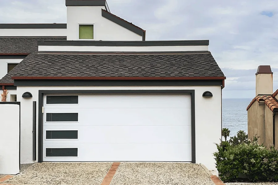 New white garage door on a coastal-style home